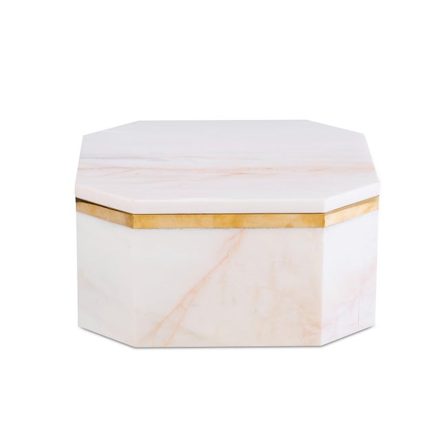 Inspired by the quiet elegance of objects gathered during a Mediterranean journey, the Andros Box pairs luminous marble...
