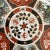 This vintage Imari plate showcases a beautiful design with colorful patterns and gold trim. It measures 8 1/8" in width...