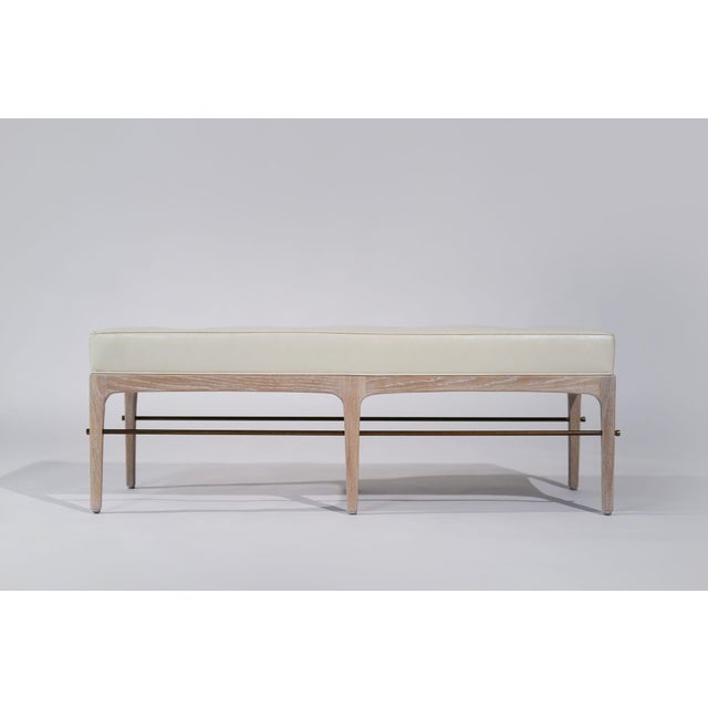 The Linear Bench is a refined take on mid-century modern design inspired by Edward Wormley with a sleek silhouette...