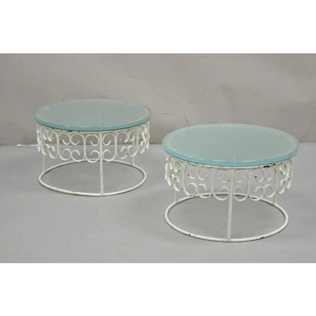 Vintage Arthur Umanoff Mid Century Modern Wrought Iron Scroll Low Round Glass Top Side Tables - a Pair. Item features...