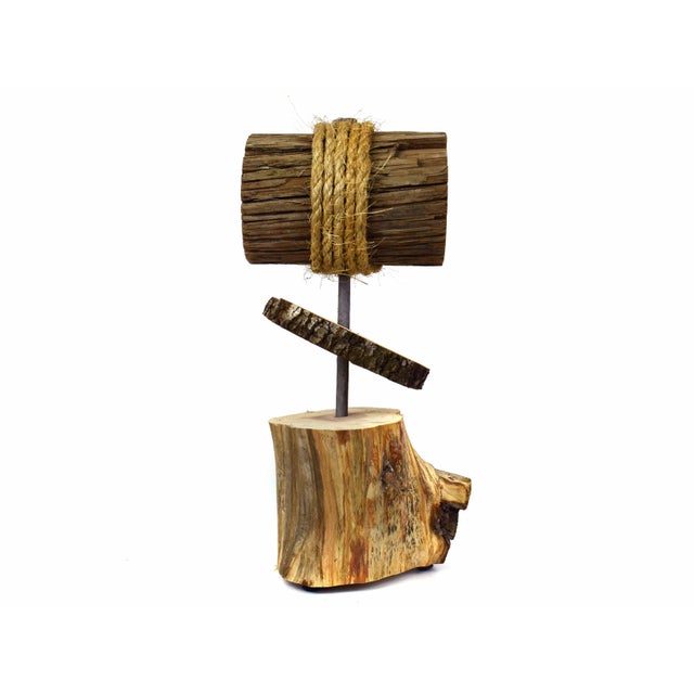 This handcrafted tabletop sculpture is offering a striking blend of organic textures and minimalist structure. Featuring a...