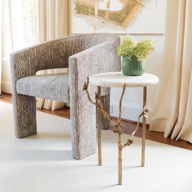 Immerse yourself in the delicate beauty of the handcrafted Modern Cherry Blossom Accent Table, where a single forged...