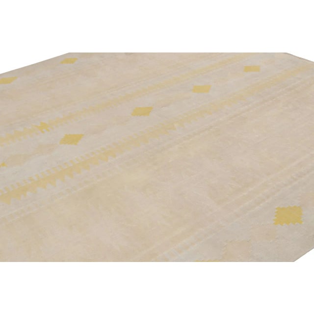 This 10x11 vintage Afghan Kilim is believed to be a traditional Ghalmouri rug, handwoven in wool circa 1970-1980. On the...