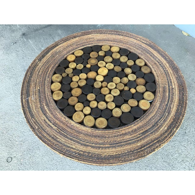 Large 48" diameter woven wicker cocktail table with modern design tropical pole center. Great outer rim perfect for...