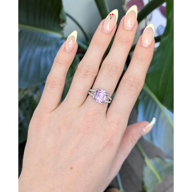 A breathtaking 6.4ct natural kunzite glows in soft lavender-pink hues, beautifully set in solid 14K gold with sparkling...