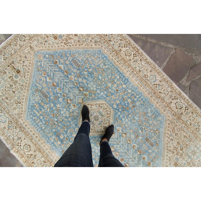 A stunning hand-knotted rug detailing beautiful botanical-inspired geometric design throughout with a single medallion....