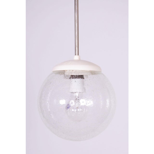 This stylish and timeless chandelier, originating from the 1960s from Czechoslovak production, represents an exceptionally...