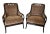 A pair of Tommy Bahama Coastal Sumatra Lounge Chairs. The frame is constructed of bent and woven rattan with scrolled arms...