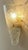 An impressive large vintage wall sconce featuring a heavy, thick handcrafted Murano ice glass shade. Sculpted into a...