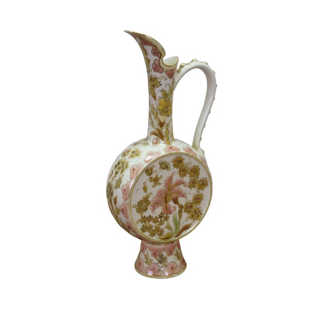 Antique 19th-century Zsolnay Pecs ceramic faience porcelain ewer pitcher originating from Hungary. The piece features a...