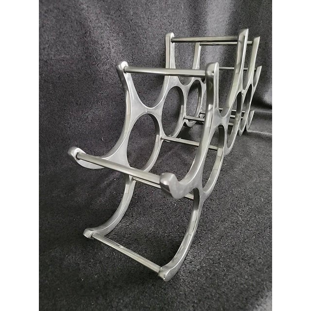 Vintage 1980 Aluminum 9 bottle wine rack. Design by Michael Noll. Sturdy. Measures in total 20"w x 9.3"h x 4.8"d Bottle...