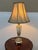 Design Plus Gallery presents a Neoclassical Cut Glass Table Lamp from Currey & Co. The lamp has an ornate cast-metal...