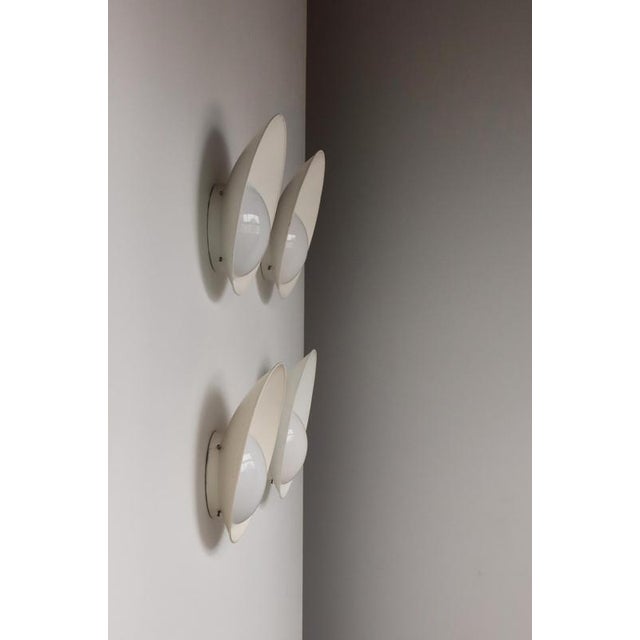 An exceptionally rare and highly sought-after set of four original Kastrup wall sconces designed by the pioneering Danish...