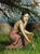 Truth by Nadezda | Oil on Panel Woman in a pink dress holding carrots in a grassy field. For Sale