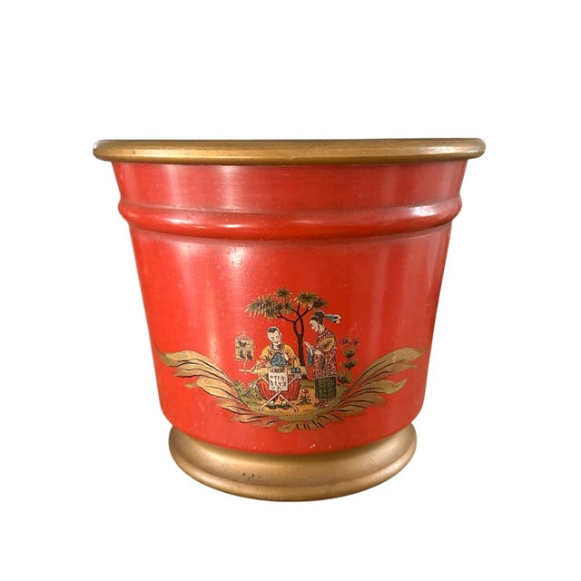 A gorgeous pair of vintage, French tole cachepots. Each features a slightly tapered frame in a deep red-orange shade...