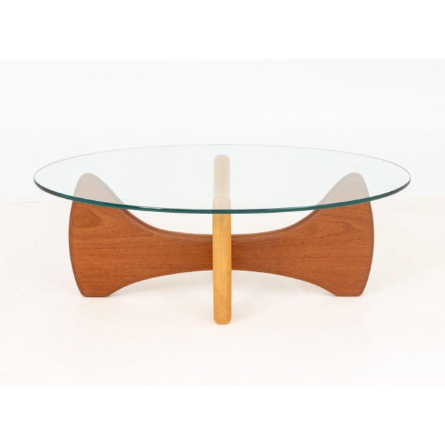 Noguchi Style Oval Glass Top and Wood Coffee Table. 14.5" H x 42" W x 27" D. Provenance: From a Warren, New Jersey...