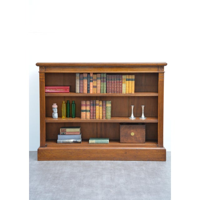 K0669 a highly desirable late victorian solid oak open bookcase of unusually low proportions, expertly crafted in england...