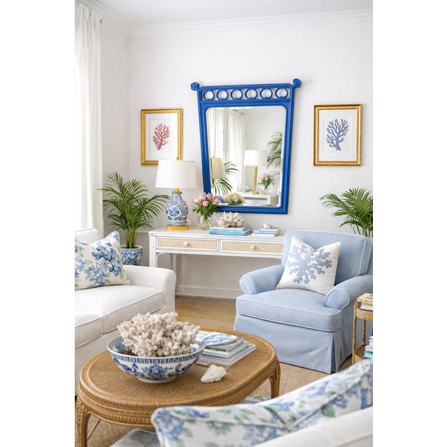 A striking vintage wall mirror featuring a beautifully sculpted frame finished in a rich cobalt blue satin lacquer. The...