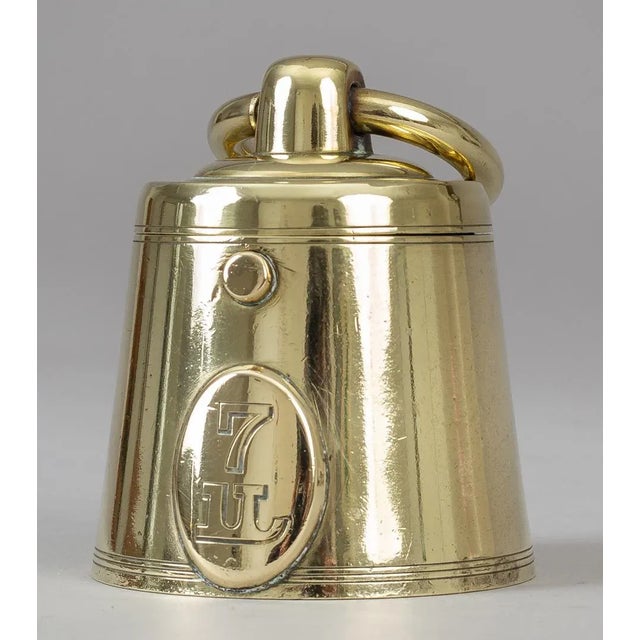 Antique solid cast brass novelty inkwell in the form of a 7lb weight with large movable ring handle. The hinged top is...