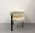 A chic pair of contemporary armchairs featuring plush ivory Mongolian lamb fur upholstery contrasted by slender black...