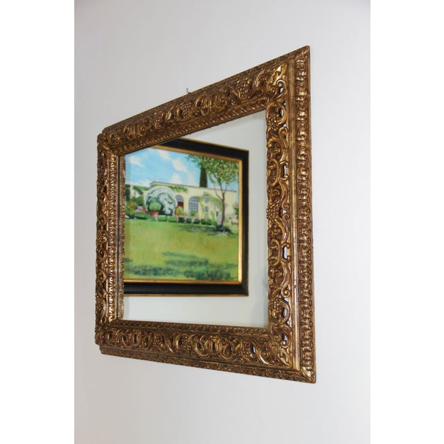 A finely carved Florentine mirror featuring a wooden Baroque-style frame with a traditional mecca fiorentina finish. The...