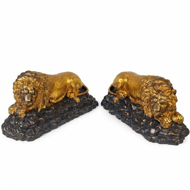 Pair of reclining lions in patinated and gilded bronze - French School, circa 1890–1920. Object: Pair of animalistic...