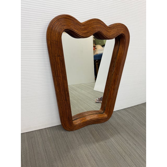 Design Plus Gallery presents the Riviera Ripple Mirror from Jonathan Adler. The mirror has a traditional shield shape with...