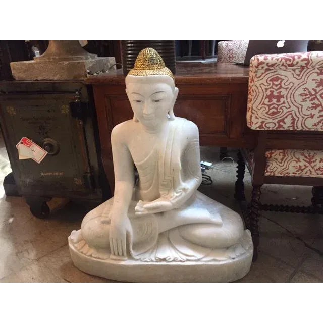 Bring a meditative Asian flair to your garden decor with this sitting Buddha outdoor statue.