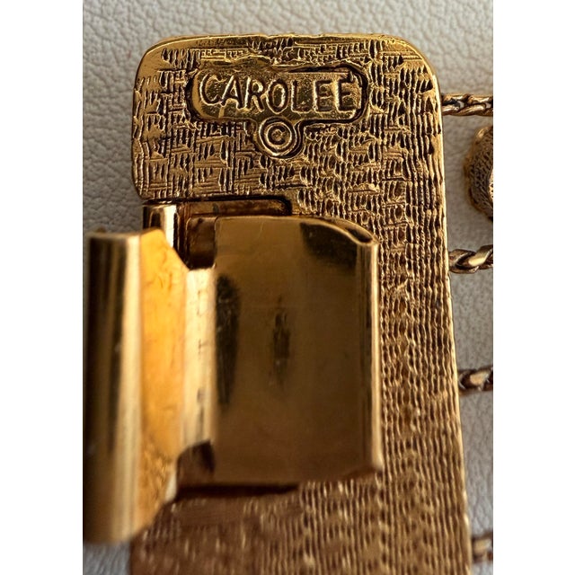 Vintage Carolee Victorian Revival style gold tone multi-row slide charm bracelet, designed with two parallel twisted wire...