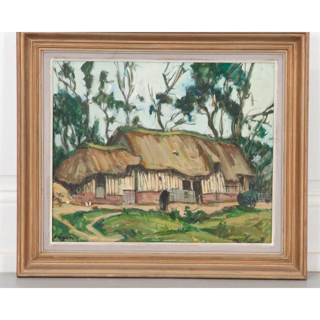 Vintage French, early 20th century (circa 1920) oil on board painting of a quaint thatched roof cottage, likely from...