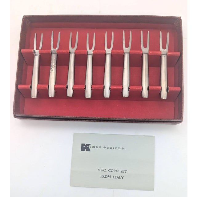 Offered is a boxed set of 8 (4 pairs) Kalmar brand stainless steel corn holders made in Italy. The two-pronged utensils...