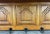 A beautifully crafted Vintage French oak wall shelf featuring five sturdy metal hooks and elegant carved detailing. This...