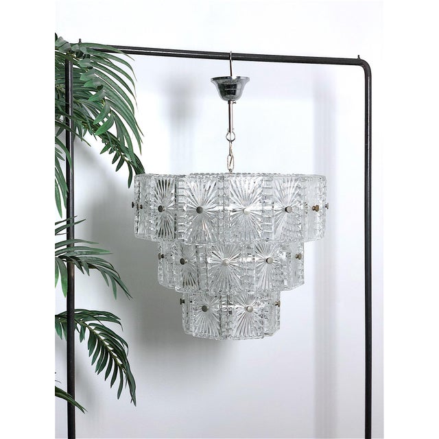 Elegant vintage chandelier from the 1960s. The chandelier is austrian-made in the 1960s, made of high-quality crystal with...