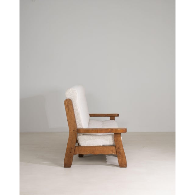 A masterwork of Belgian Brutalist design from circa 1970, this oak upholstered sofa embodies the movement's defining...