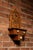 Hand-cut wooden wall cabinet featuring an elaborate openwork crest centered around Masonic iconography, including the...