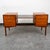 Teak executive desk with brass handles, 5 drawers including file cabinets and storage. Comes with unique black central...