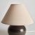 With a blue crackle glazed body and light linen shade, this lamp is a handsome fixture. At just around 10 inches tall, it,...