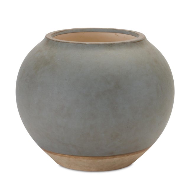 Elevate your interior design with this sophisticated Two Tone Ceramic Vase. Featuring a classic urn silhouette, this...