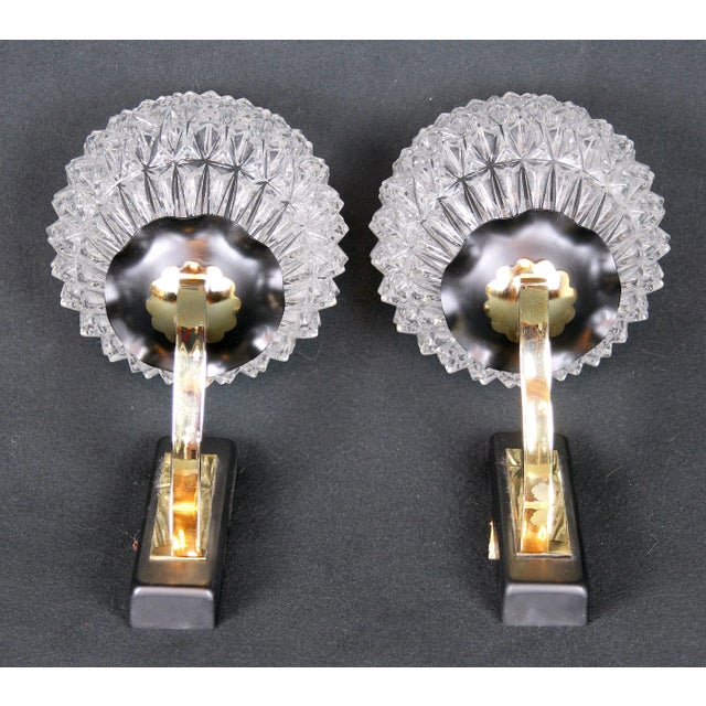 Beautiful Mid-Century from Maison Arlus Black metal and Brass, Pair of Sconces, produced in France, circa 1955. This pair...