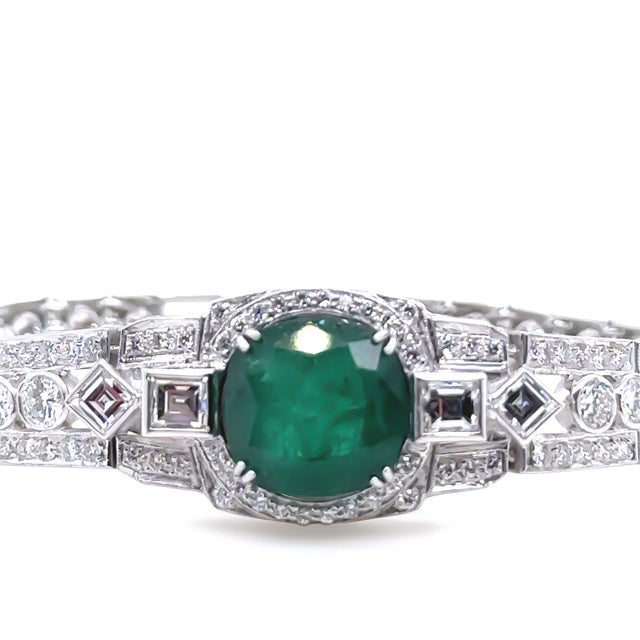 A Emerald & Diamond Set "Art-Deco" Bracelet, made of 14ct White Gold. Featuring One Natural Beryl Mixed Cut Emerald in a...