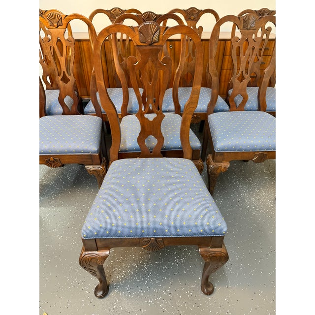 This is a set of 8 mid- 1980's Pennsylvania House Queen Anne Style Dining Chairs. They are upholstered with gorgeous blue...