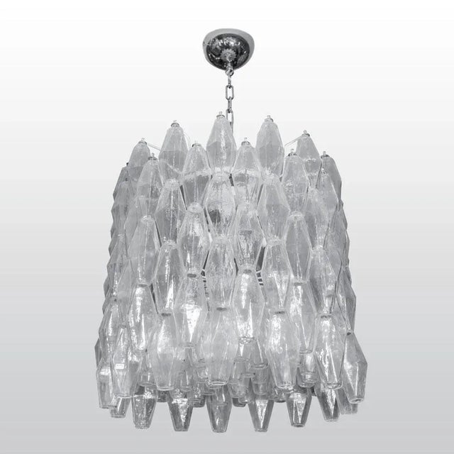 A large drum-shaped Venini Poliedri chandelier, hand blown clear glass Poliedri components on white an enamelled steel...