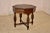 19th century oak side table from France with an octagonal shaped top. The top has a carved decorated band inside a beveled...
