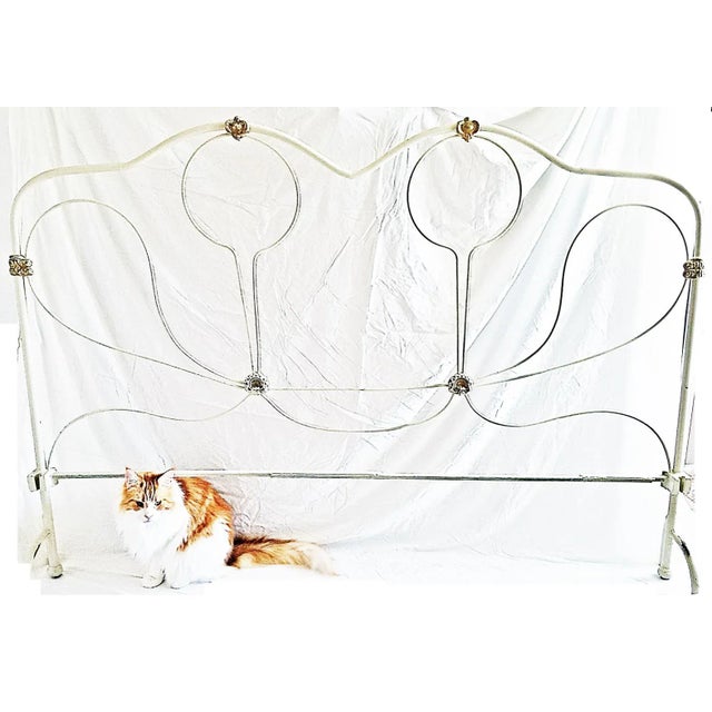 Here's a unique wrought steel King sized headboard painted in rustoleum old white, worn gilded accents. A nice understated...