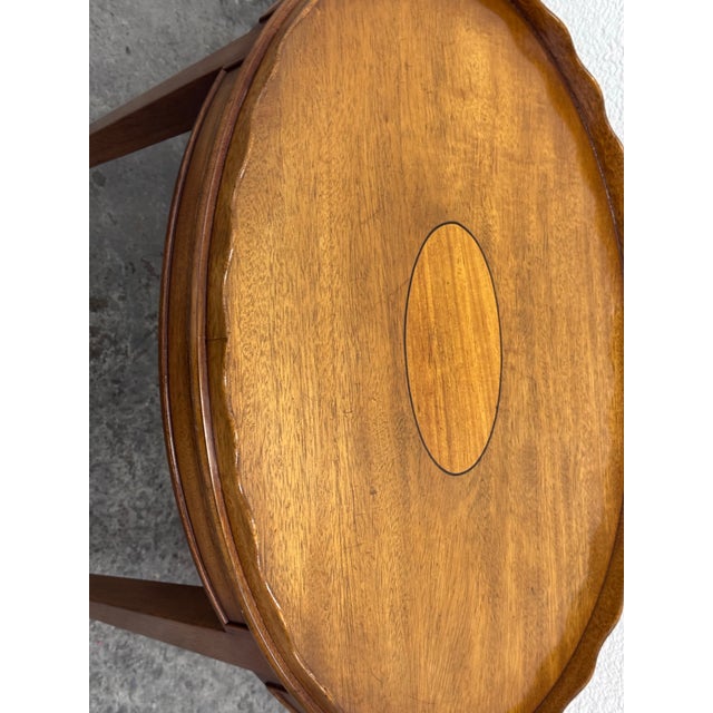 Design Plus Gallery presents a 20th Century Oval Side Table With Scalloped Gallery By Kittinger. Classic oval table in...