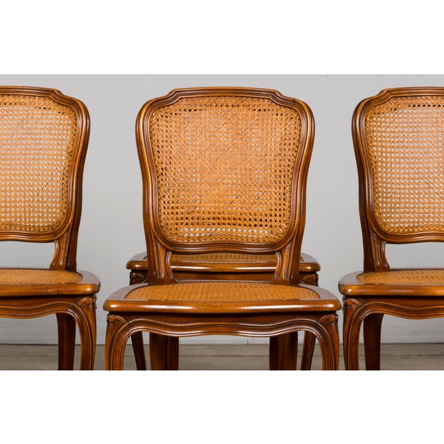 A beautiful set of eight early 20th-century French Louis XV style dining chairs, sourced in Provence, France. Crafted in...