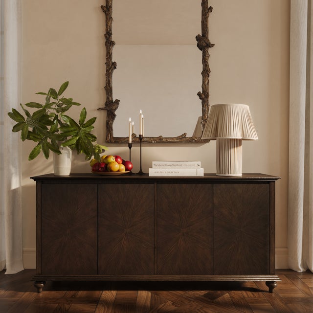 The Mila Dark Brown Wood Sideboard brings sophistication and functionality to your dining or living space. Crafted with a...
