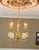 Gorgeous 5-arm hospitality chandelier, featuring pineapple-shaped, precision cut, clear crystal motif on polished brass...