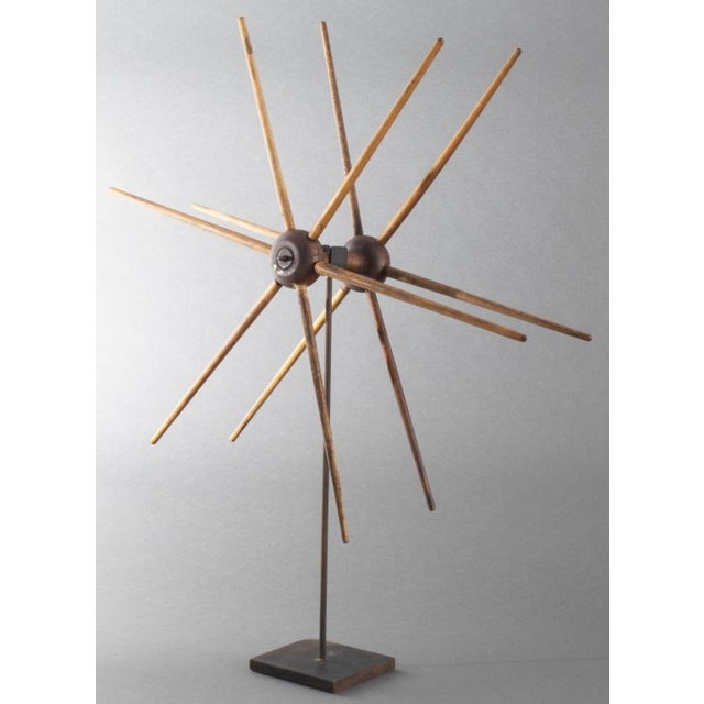 American Primitive Wooden Yarn Winder, 19th century, mounted on an ebonized metal stand. Overall: 26.75" H; 21" Diameter x...