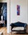 Two buds, one violet and one cobalt, sit one above the other on this tall panel, joined by a magenta spiral at the center....